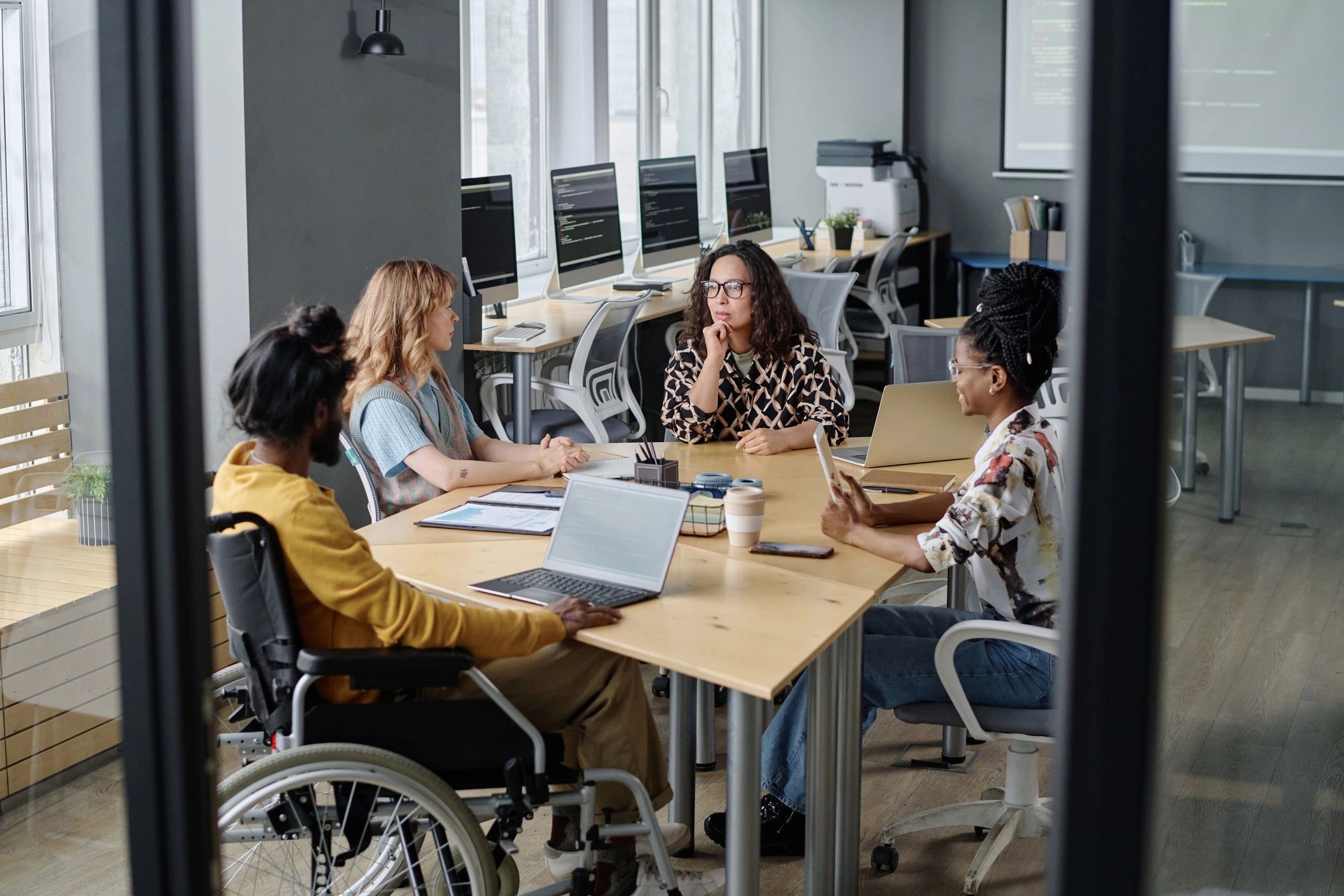 Consultation team reviewing client information in an office